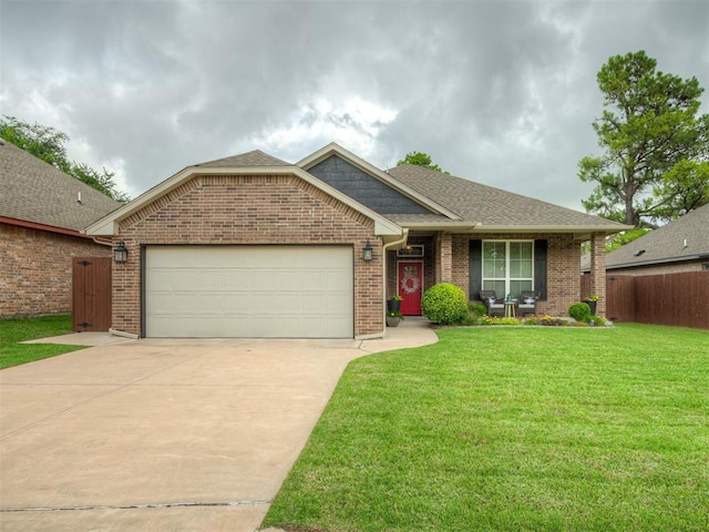 2204 Cale Cv, Yukon, OK 73099 - view of front facade with an attached garage, concrete driveway, brick siding, and roof with shingles