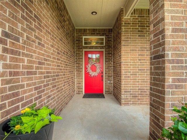 2204 Cale Cv, Yukon, OK 73099 - view of exterior entry featuring brick siding