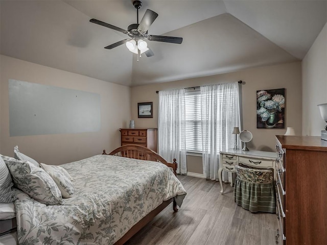 2204 Cale Cv, Yukon, OK 73099 - bedroom featuring lofted ceiling, light wood-style floors, and a ceiling fan