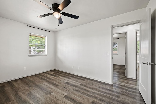 311 N Monroe Ave, Blanchard, OK 73010 - unfurnished room with dark wood finished floors and ceiling fan