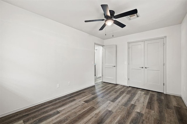 311 N Monroe Ave, Blanchard, OK 73010 - unfurnished bedroom featuring wood finished floors, a closet, and a ceiling fan