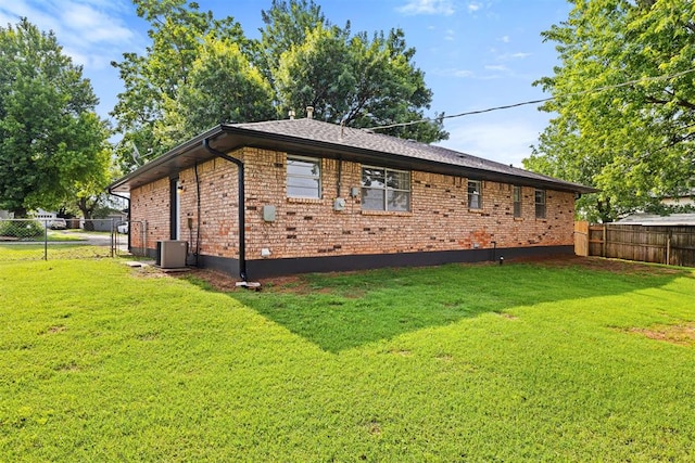 311 N Monroe Ave, Blanchard, OK 73010 - view of home's exterior with a fenced backyard and brick siding