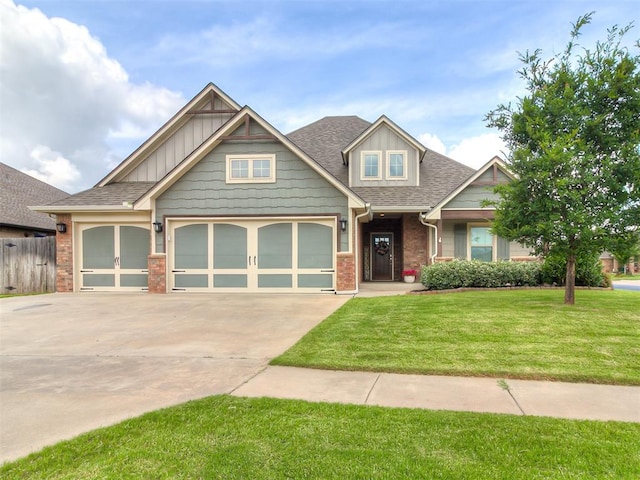 12917 Treemont Ln, Oklahoma City, OK 73142 - craftsman house with a garage, driveway, a shingled roof, and brick siding