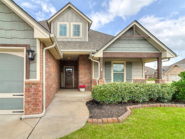 12917 Treemont Ln, Oklahoma City, OK 73142 - view of front facade with roof with shingles, brick siding, and board and batten siding