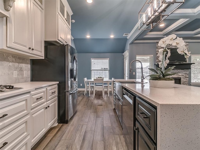 12917 Treemont Ln, Oklahoma City, OK 73142 - kitchen with appliances with stainless steel finishes, decorative backsplash, dark wood-style floors, white cabinetry, and recessed lighting