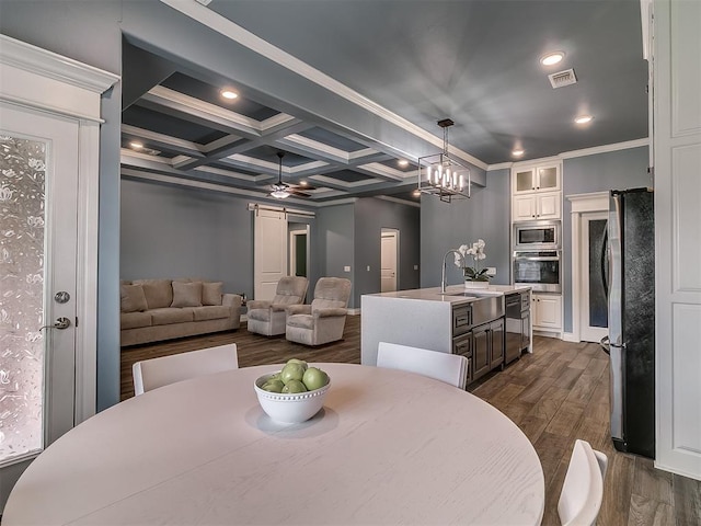 12917 Treemont Ln, Oklahoma City, OK 73142 - dining room featuring dark wood-type flooring, beamed ceiling, recessed lighting, a ceiling fan, and coffered ceiling