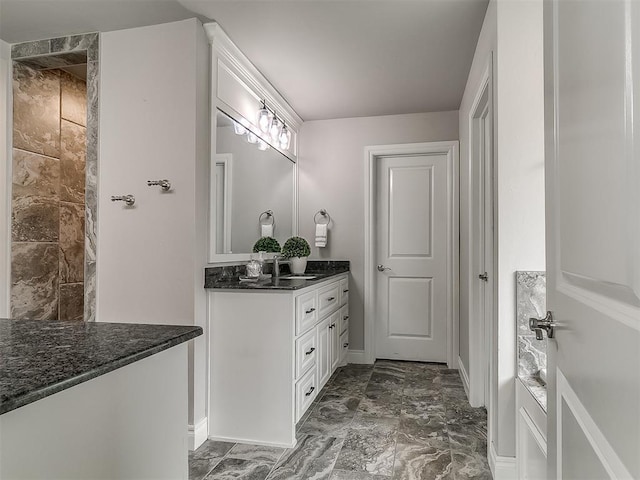 12917 Treemont Ln, Oklahoma City, OK 73142 - bathroom with vanity, marble finish flooring, and tiled shower