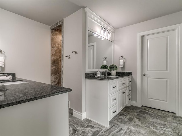 12917 Treemont Ln, Oklahoma City, OK 73142 - bathroom featuring marble look tiles, vanity, and tiled shower