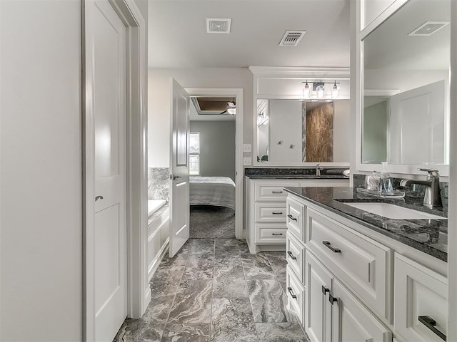 12917 Treemont Ln, Oklahoma City, OK 73142 - full bathroom featuring vanity, connected bathroom, and marble finish floors