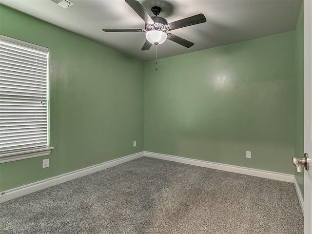 12917 Treemont Ln, Oklahoma City, OK 73142 - unfurnished room with a ceiling fan and dark carpet