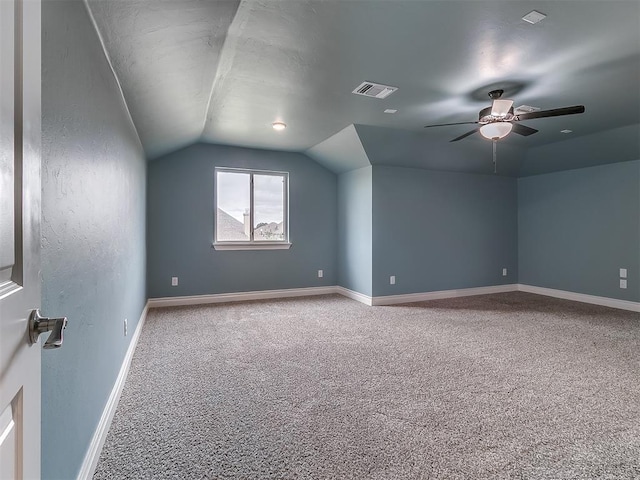 12917 Treemont Ln, Oklahoma City, OK 73142 - additional living space with carpet flooring, lofted ceiling, and ceiling fan