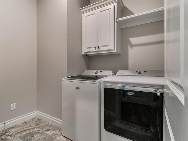 12917 Treemont Ln, Oklahoma City, OK 73142 - washroom with washing machine and clothes dryer, cabinet space, and marble finish floors