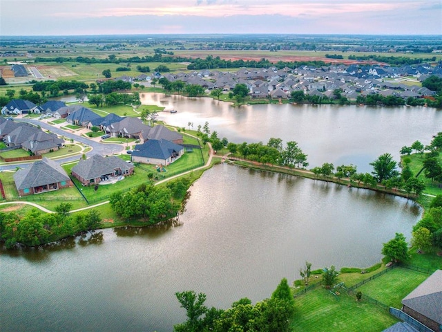 12917 Treemont Ln, Oklahoma City, OK 73142 - aerial view at dusk of a water view and a residential view
