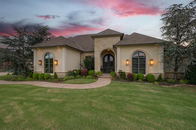 3617 Stagmoor Rd, Edmond, OK 73034 - view of front of property with french doors, stone siding, a front yard, and stucco siding