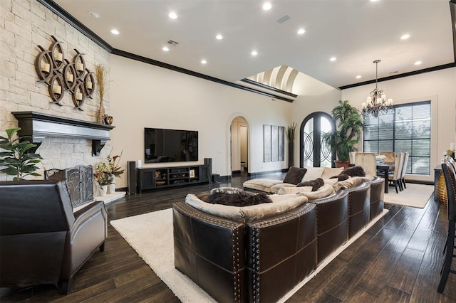 3617 Stagmoor Rd, Edmond, OK 73034 - living room with arched walkways, ornamental molding, a chandelier, recessed lighting, and wood finished floors
