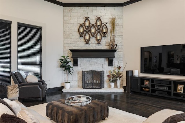 3617 Stagmoor Rd, Edmond, OK 73034 - living room with wood finished floors, crown molding, and a stone fireplace