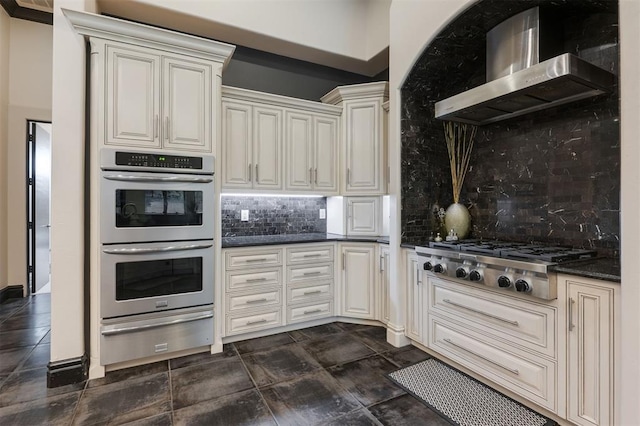 3617 Stagmoor Rd, Edmond, OK 73034 - kitchen featuring stainless steel appliances, wall chimney range hood, a warming drawer, and decorative backsplash