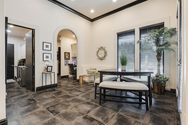 3617 Stagmoor Rd, Edmond, OK 73034 - dining area featuring crown molding, recessed lighting, and arched walkways