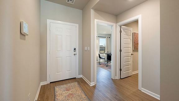 6113 Green Meadows Ln, Oklahoma City, OK 73132 - foyer featuring wood finished floors and baseboards