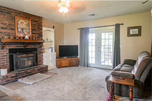 1383 N Peebly Rd, Choctaw, OK 73020 - carpeted living room with a textured ceiling and french doors