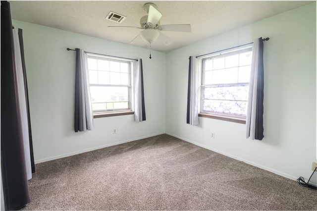 1383 N Peebly Rd, Choctaw, OK 73020 - empty room featuring ceiling fan, carpet, and a textured ceiling