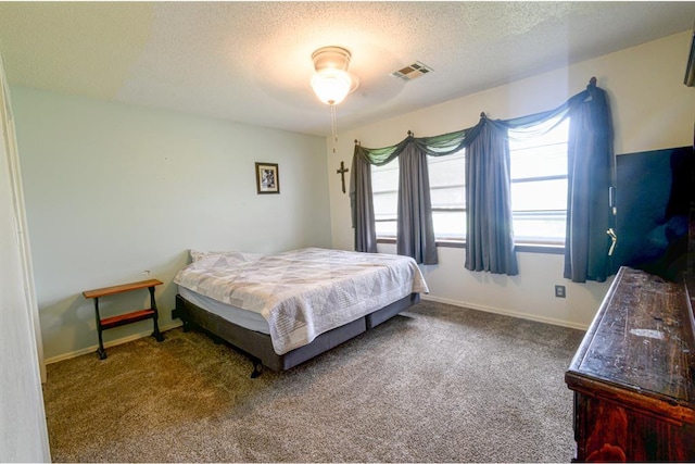 1383 N Peebly Rd, Choctaw, OK 73020 - bedroom featuring a textured ceiling and carpet flooring