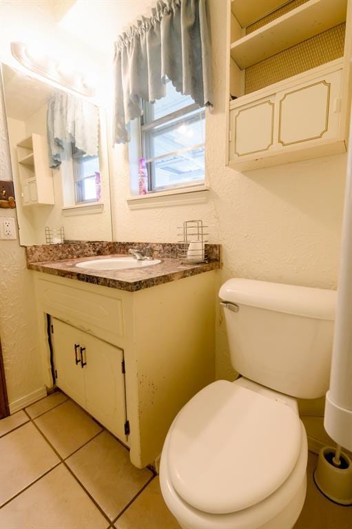 1383 N Peebly Rd, Choctaw, OK 73020 - half bathroom featuring vanity, a textured wall, and tile patterned floors