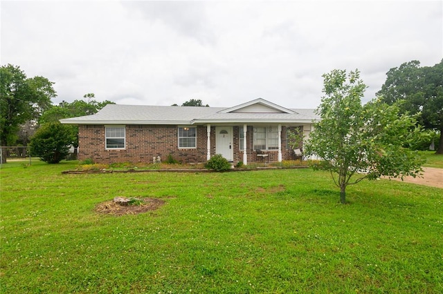 1383 N Peebly Rd, Choctaw, OK 73020 - ranch-style home featuring a front lawn and brick siding