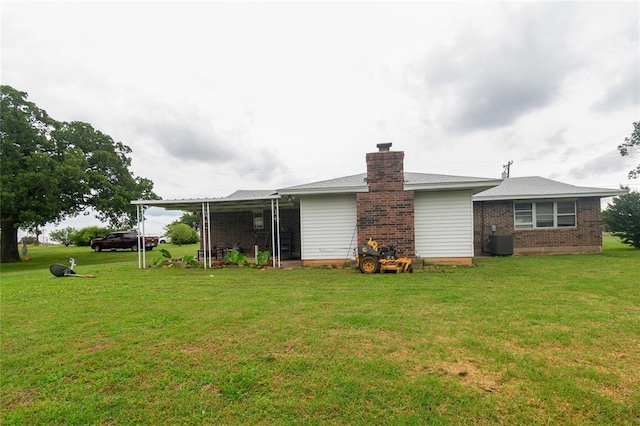 1383 N Peebly Rd, Choctaw, OK 73020 - rear view of house with a yard, brick siding, and a chimney