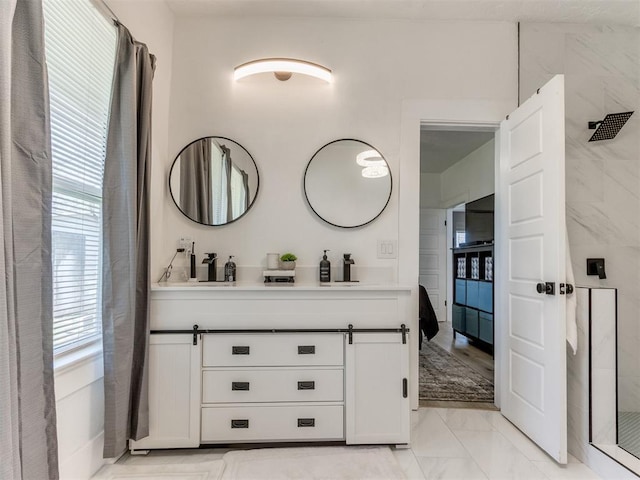 1317 N Wisconsin Ave, Oklahoma City, OK 73117 - full bath featuring double vanity, marble look tile flooring, and a shower