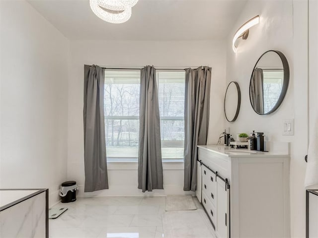 1317 N Wisconsin Ave, Oklahoma City, OK 73117 - full bathroom with double vanity and marble finish floors