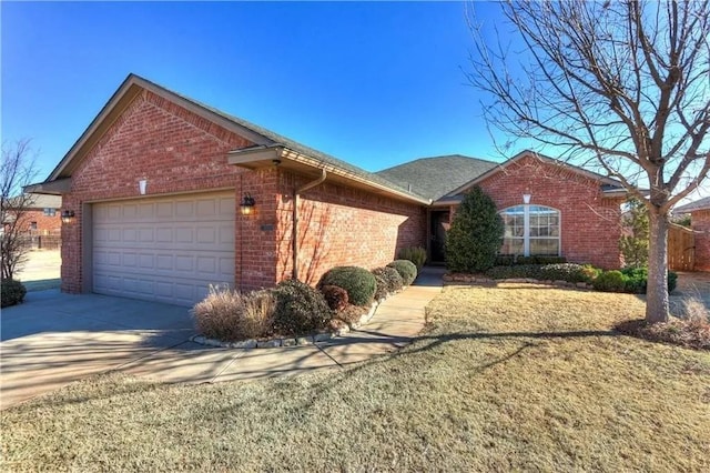 15924 Prairie Run Dr, Edmond, OK 73013 - ranch-style house with brick siding, a garage, and concrete driveway