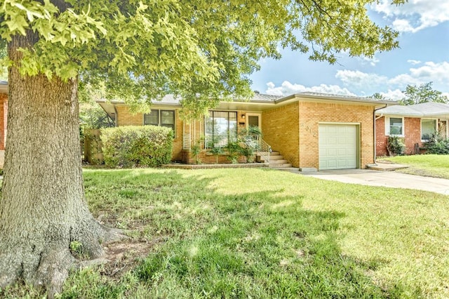 3012 NW 67th St, Oklahoma City, OK 73116 - ranch-style house featuring an attached garage, driveway, brick siding, and a front lawn