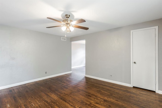 3012 NW 67th St, Oklahoma City, OK 73116 - spare room with ceiling fan and dark wood-type flooring