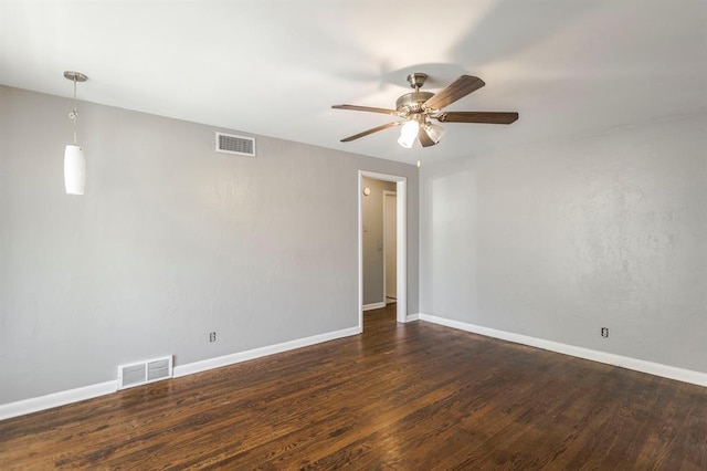 3012 NW 67th St, Oklahoma City, OK 73116 - spare room featuring a ceiling fan and dark wood-type flooring