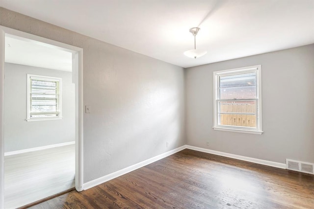 3012 NW 67th St, Oklahoma City, OK 73116 - spare room with dark wood-style floors and baseboards