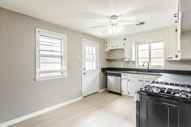 3012 NW 67th St, Oklahoma City, OK 73116 - kitchen featuring dishwasher, dark countertops, plenty of natural light, and a ceiling fan