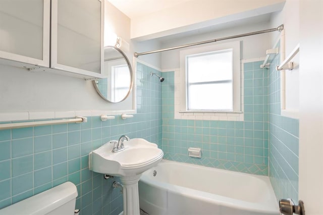 3012 NW 67th St, Oklahoma City, OK 73116 - full bath with bathtub / shower combination, tile walls, and a wainscoted wall