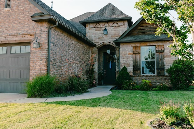 12113 SW 45th Ter, Mustang, OK 73064 - view of front facade featuring an attached garage, a front lawn, roof with shingles, and brick siding