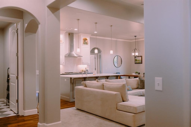 12113 SW 45th Ter, Mustang, OK 73064 - living room with arched walkways, dark wood-type flooring, and recessed lighting