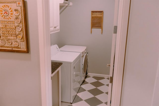 12113 SW 45th Ter, Mustang, OK 73064 - laundry area with light floors, washer and clothes dryer, and cabinet space