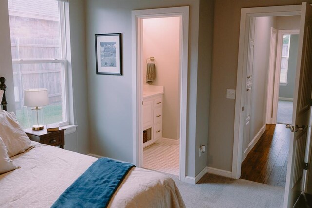 12113 SW 45th Ter, Mustang, OK 73064 - bedroom featuring carpet floors and connected bathroom