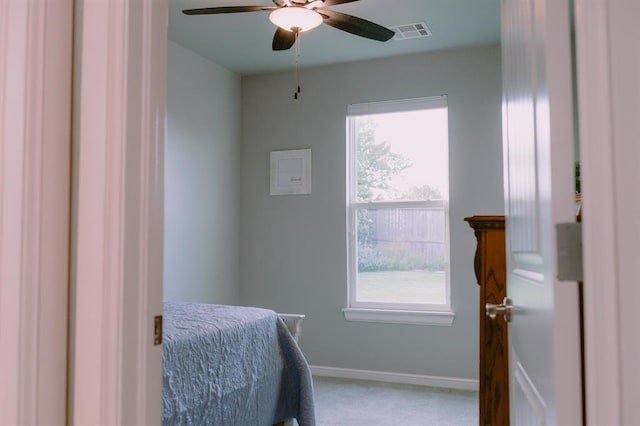 12113 SW 45th Ter, Mustang, OK 73064 - bedroom featuring light carpet and a ceiling fan