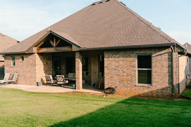 12113 SW 45th Ter, Mustang, OK 73064 - back of property featuring a patio area, brick siding, roof with shingles, and a yard