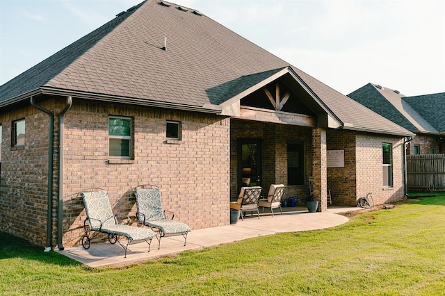 12113 SW 45th Ter, Mustang, OK 73064 - rear view of house featuring a patio, roof with shingles, and brick siding