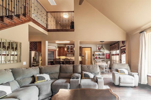 4417 Man O War Dr, Edmond, OK 73025 - living room with high vaulted ceiling and wood finished floors