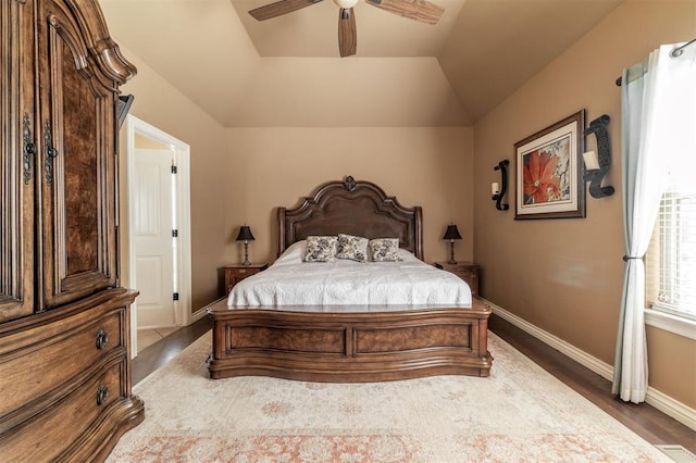 4417 Man O War Dr, Edmond, OK 73025 - bedroom with wood finished floors, ceiling fan, and vaulted ceiling