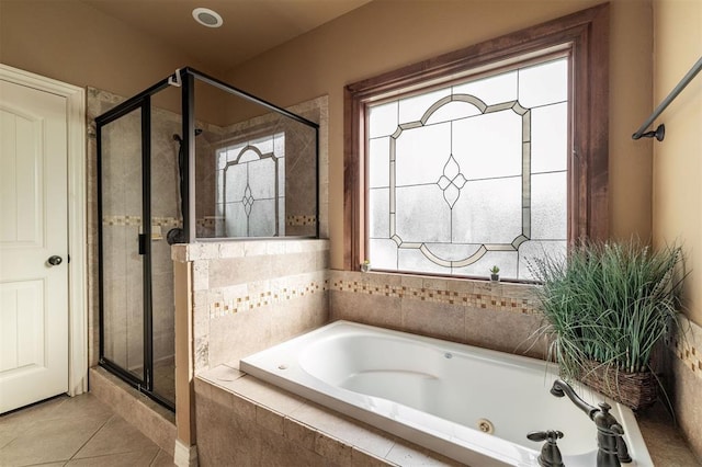 4417 Man O War Dr, Edmond, OK 73025 - bathroom featuring a tub with jets, a stall shower, and tile patterned floors