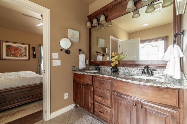 4417 Man O War Dr, Edmond, OK 73025 - ensuite bathroom with double vanity and tile patterned floors