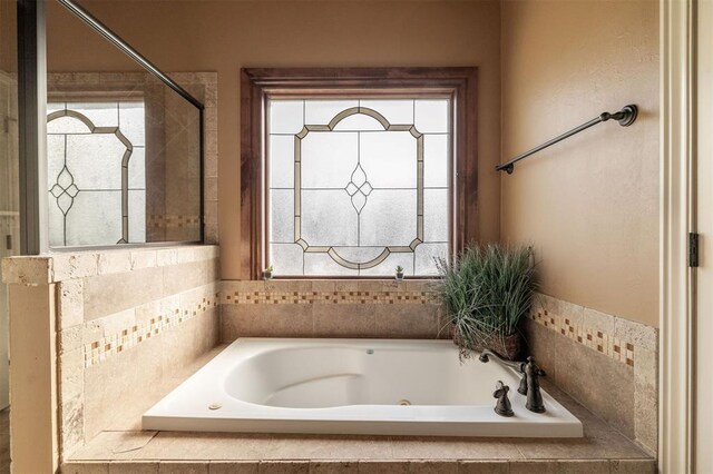 4417 Man O War Dr, Edmond, OK 73025 - full bath with a whirlpool tub and plenty of natural light